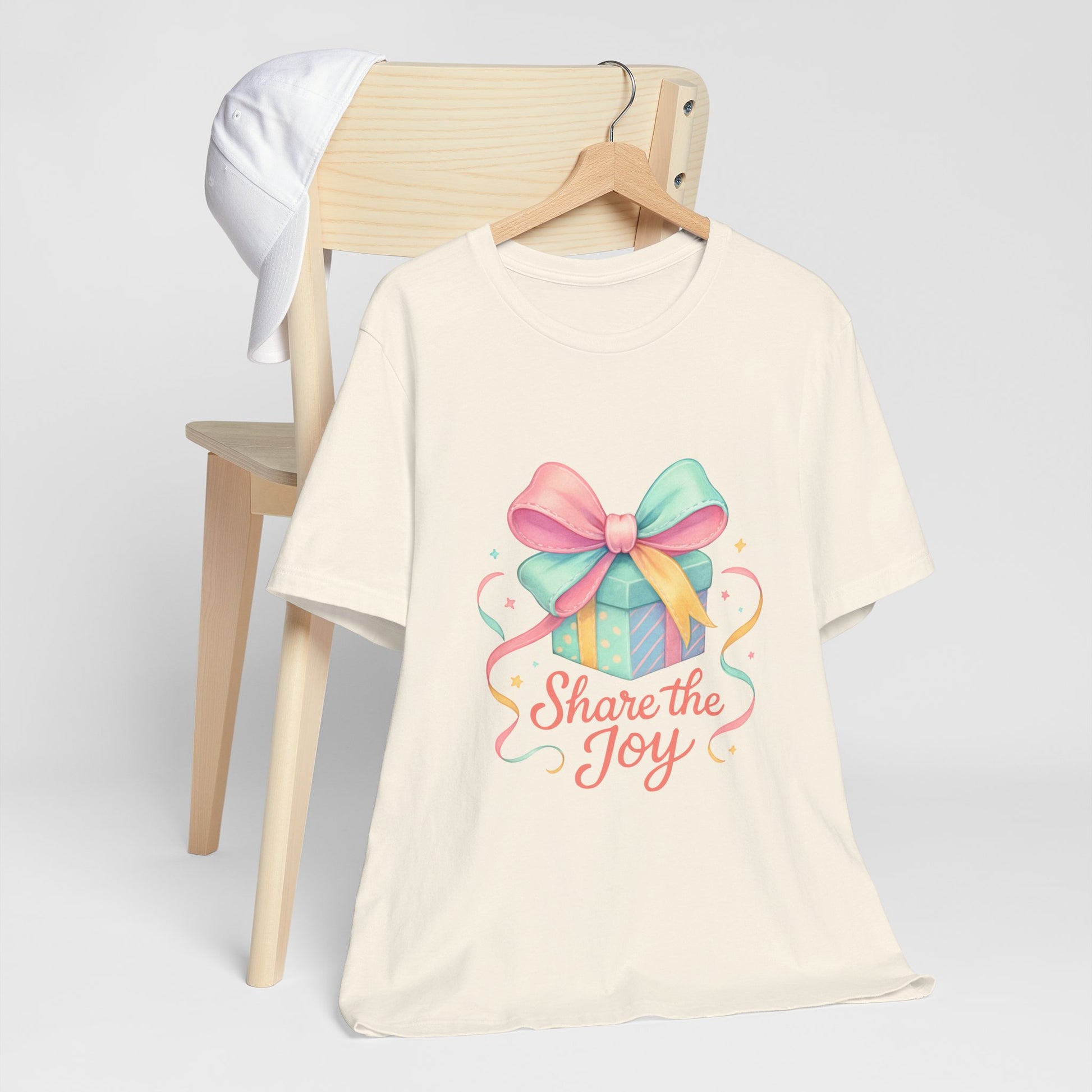 Share the Joy Gift Tee — Pastel Present Graphic T-Shirt Printify